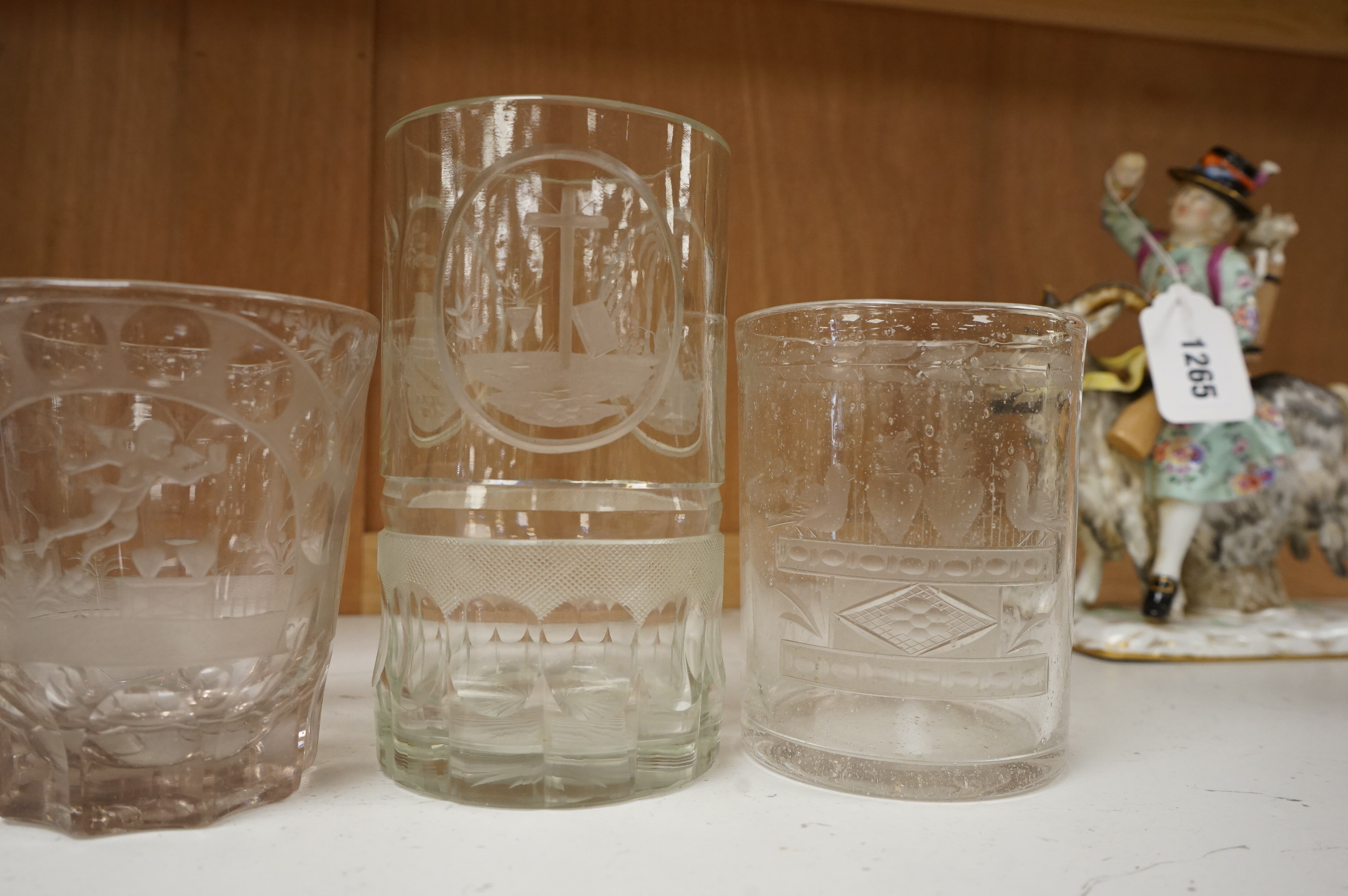 Four German or Bohemian engraved glass beakers, 19th century, largest 16cm high